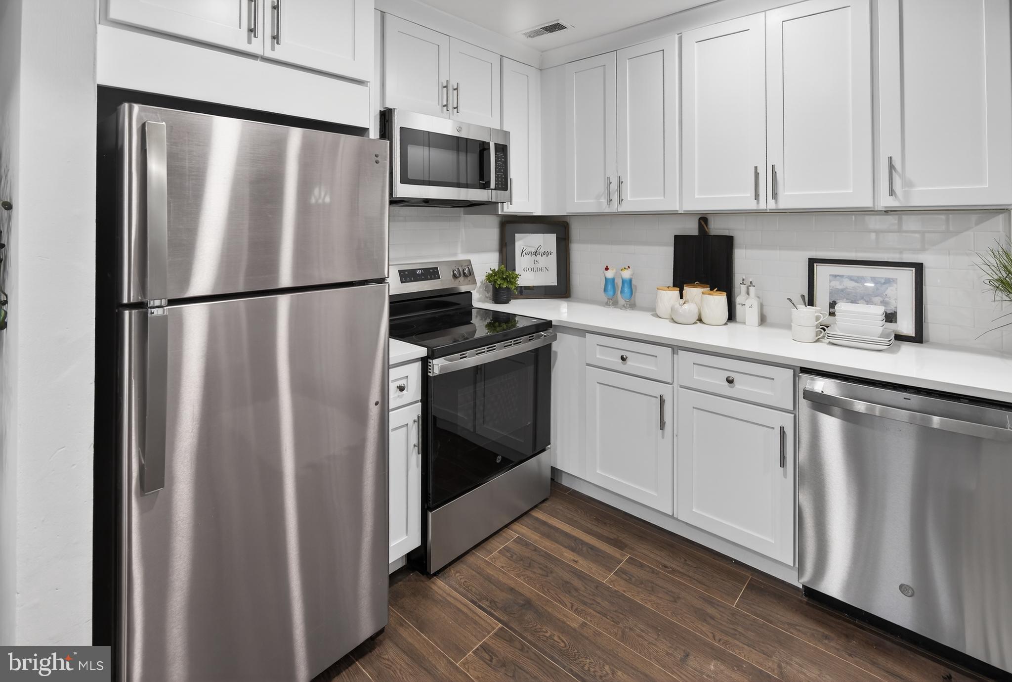 474 St Mary Street Burlington, NJ 08016 - Photo 2 of 30 a kitchen with stainless steel appliances a refrigerator sink and cabinets