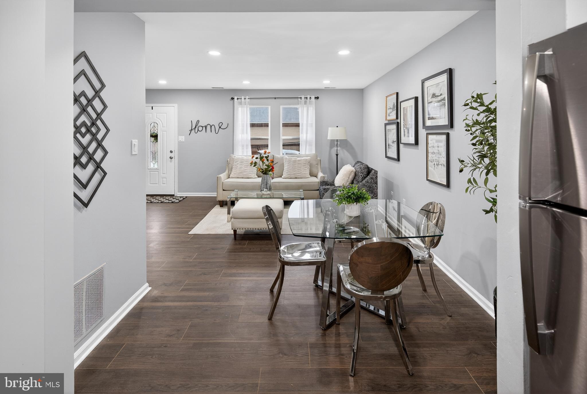 474 St Mary Street Burlington, NJ 08016 - Photo 9 of 30 a living room with furniture a dining table and a refrigerator