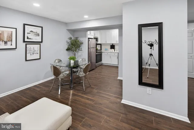 a workspace with wooden floor and furniture