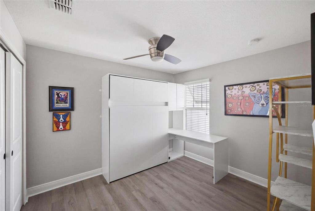 2013 Sunset Wind Loop Oldsmar, FL 34677 - Photo 23 of 43 a view of empty room with wooden floor and window