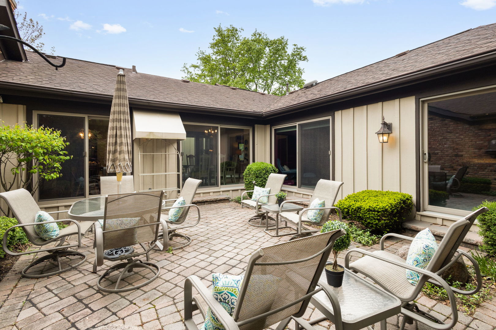 715 Tomlin Drive, Unit A1 Burr Ridge, IL 60527 - Photo 20 of 24 a view of a patio with couple of chairs and a potted plant
