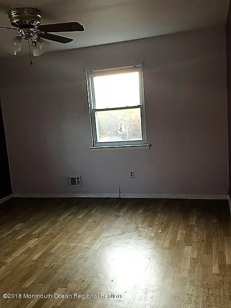 534 Line Road Hazlet, NJ 07730 - Photo 14 of 21 an empty room with a window