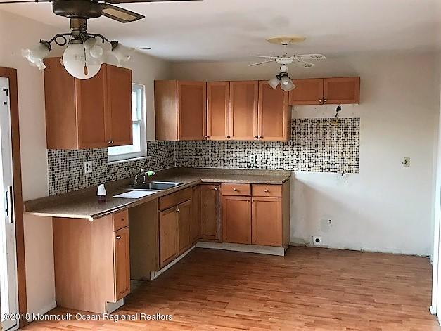 534 Line Road Hazlet, NJ 07730 - Photo 3 of 21 a kitchen with a sink cabinets and window