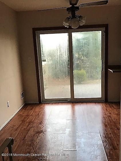 534 Line Road Hazlet, NJ 07730 - Photo 10 of 21 a view of a room with a floor to ceiling window and a ceiling fan