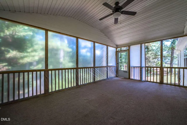 a view of an empty room with a large window