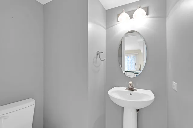 a bathroom with a sink and mirror