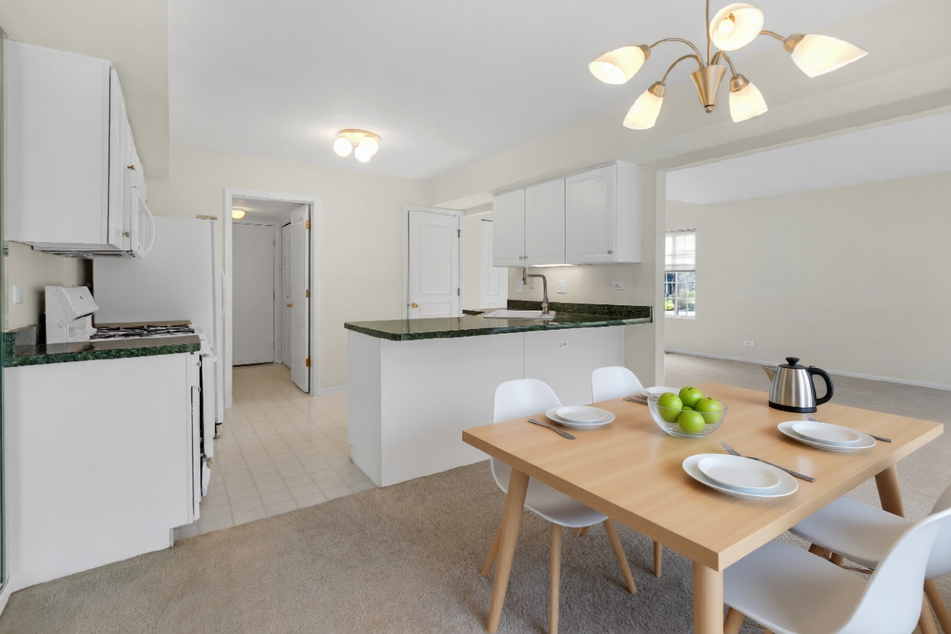 148 Locksley Drive Streamwood, IL 60107 - Photo 9 of 20 a view of a dining room with furniture and wooden floor