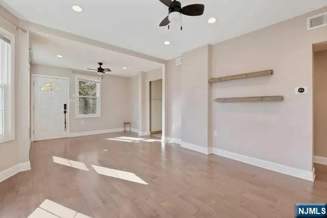 a view of an empty room with a window