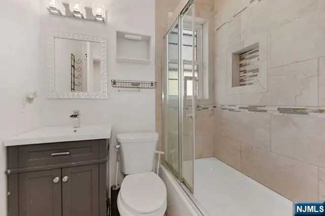a bathroom with a toilet a sink and bathtub