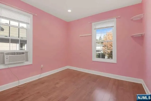a view of a livingroom with an empty space and window