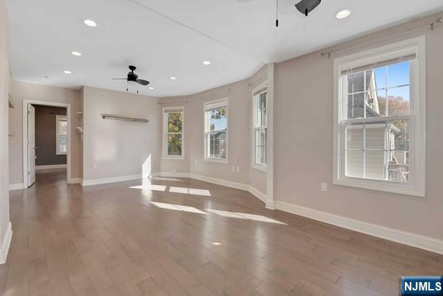 23 Donaldson Avenue, Unit 2 Rutherford, NJ 07070 - Photo 10 of 32 a view of an empty room with wooden floor and a window