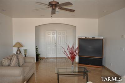 1415 Calle Monclova Rio Rico, AZ 85648 - Photo 9 of 16 a living room with furniture and a flat screen tv