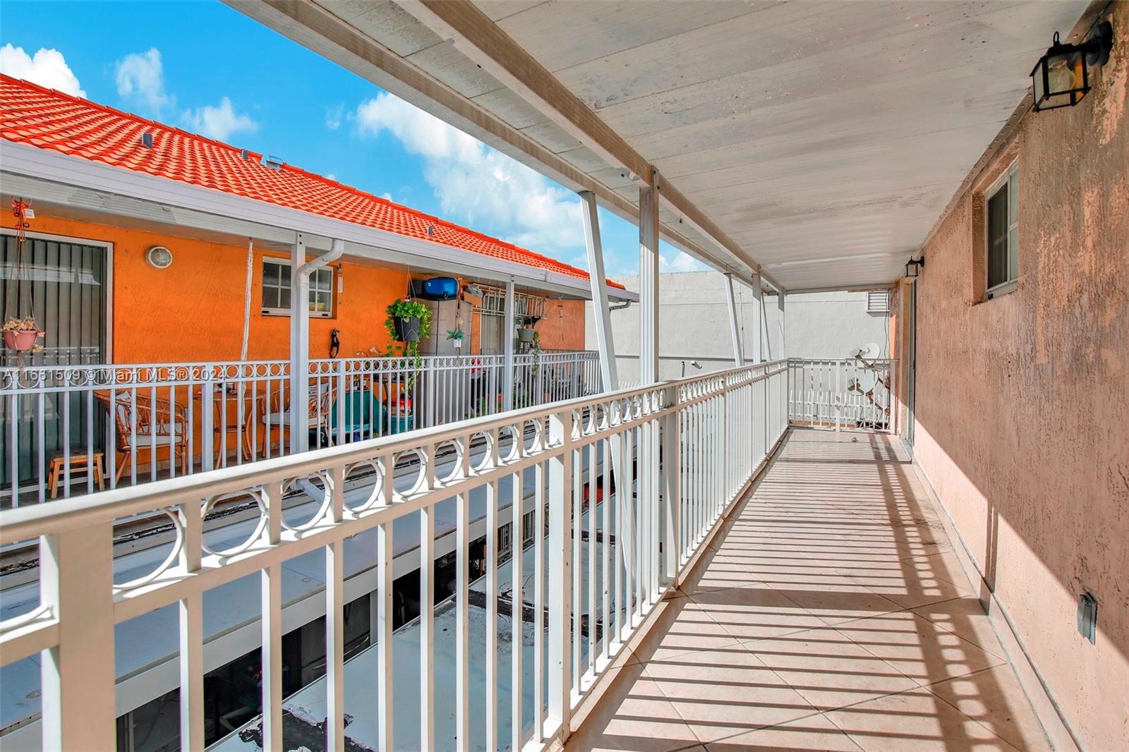 2527 West 76th Street, Unit 208 Hialeah, FL 33016 - Photo 16 of 37 a view of a building from a balcony