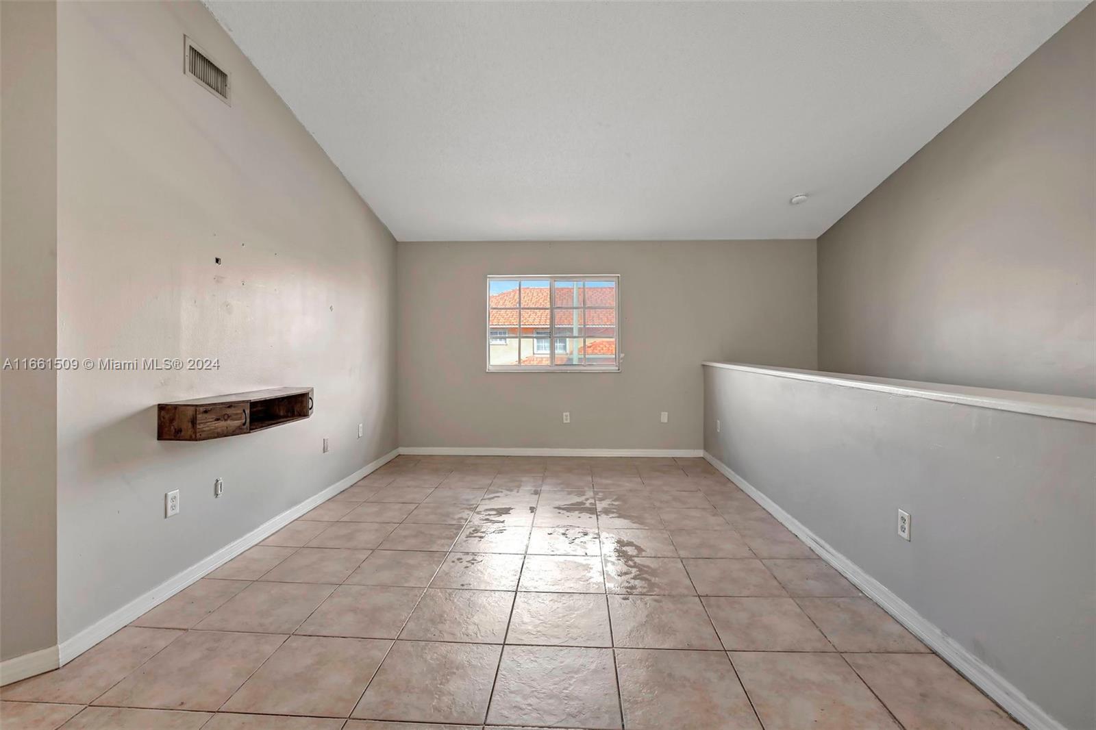 2527 West 76th Street, Unit 208 Hialeah, FL 33016 - Photo 18 of 37 a view of an empty room and window