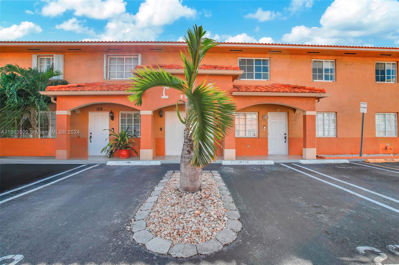 2527 West 76th Street, Unit 208 Hialeah, FL 33016 - Photo 2 of 37 front view of a house with a street