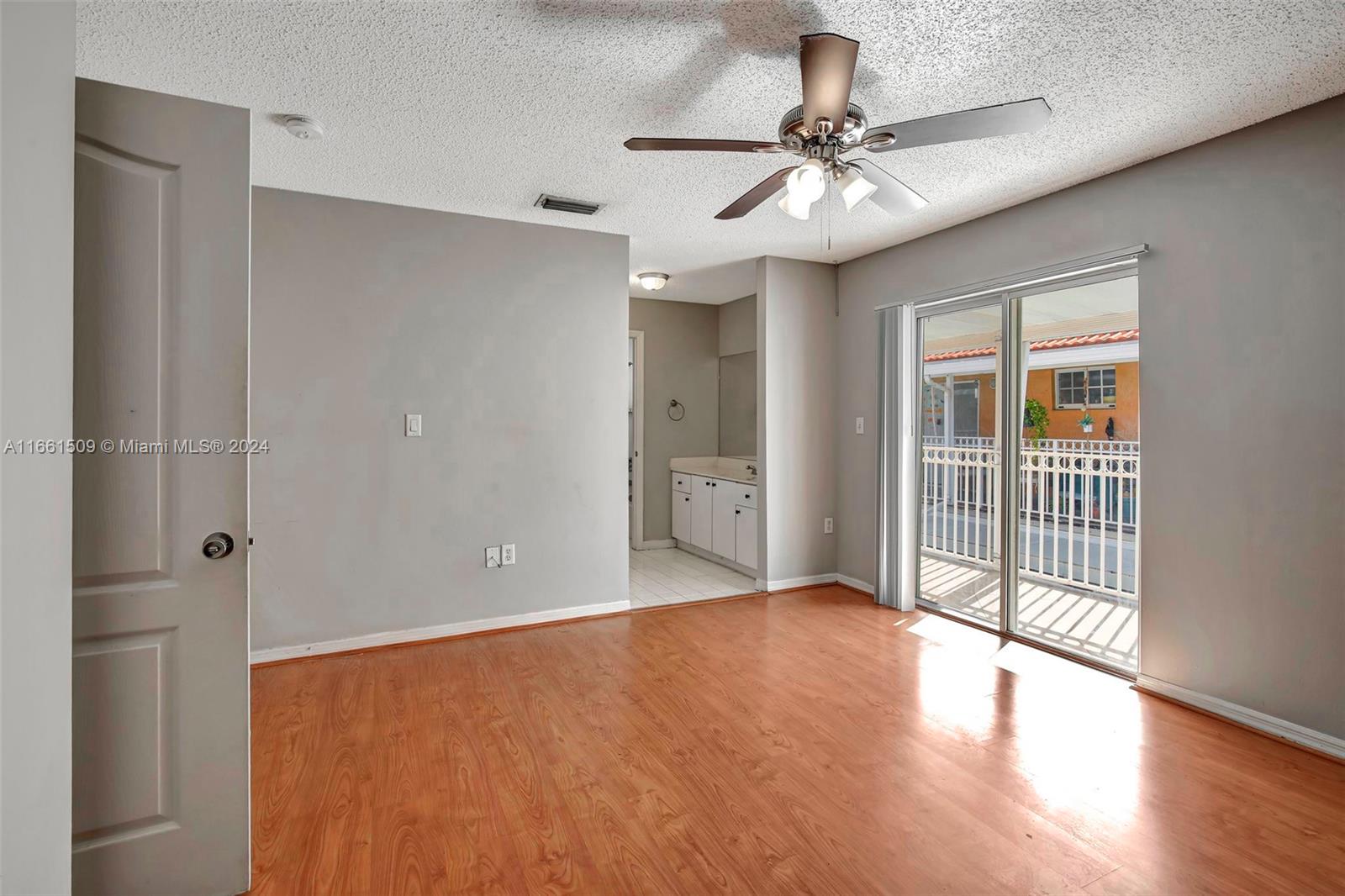 2527 West 76th Street, Unit 208 Hialeah, FL 33016 - Photo 21 of 37 a view of an empty room with a window