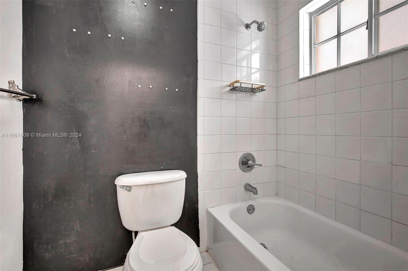 2527 West 76th Street, Unit 208 Hialeah, FL 33016 - Photo 27 of 37 a bathroom with a toilet a sink and bathtub