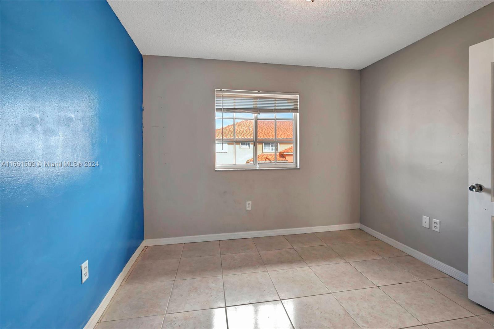 2527 West 76th Street, Unit 208 Hialeah, FL 33016 - Photo 32 of 37 a view of a room that has a window in it