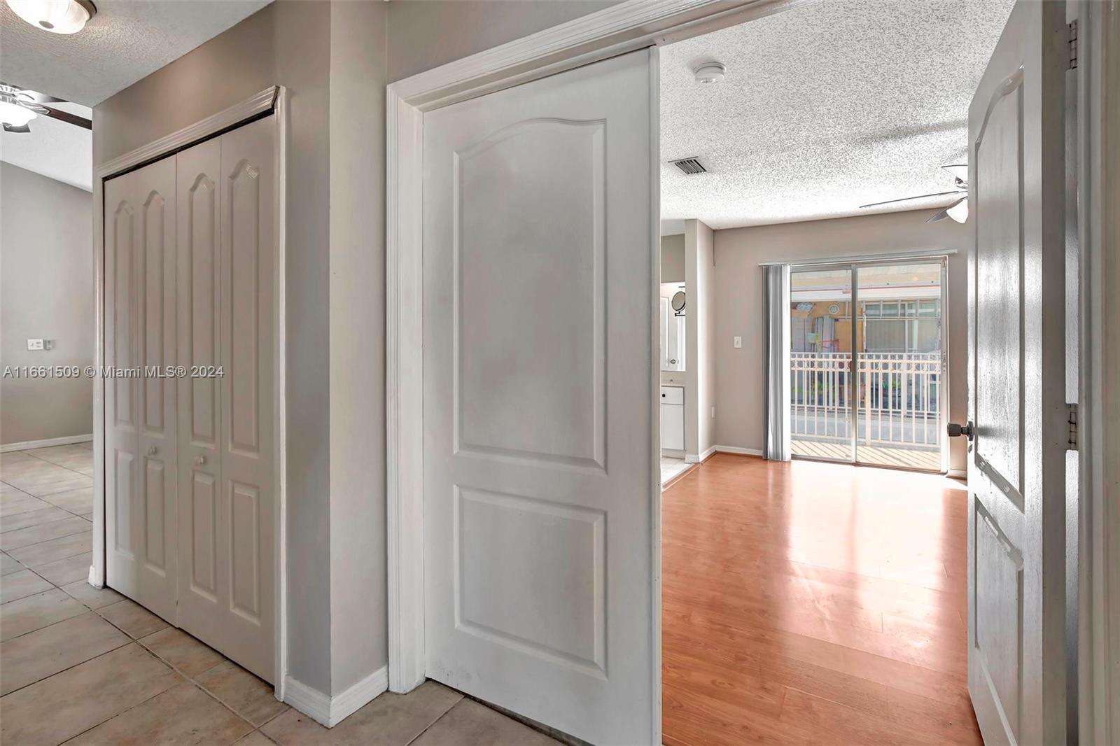 2527 West 76th Street, Unit 208 Hialeah, FL 33016 - Photo 33 of 37 a view of an entryway with wooden floor