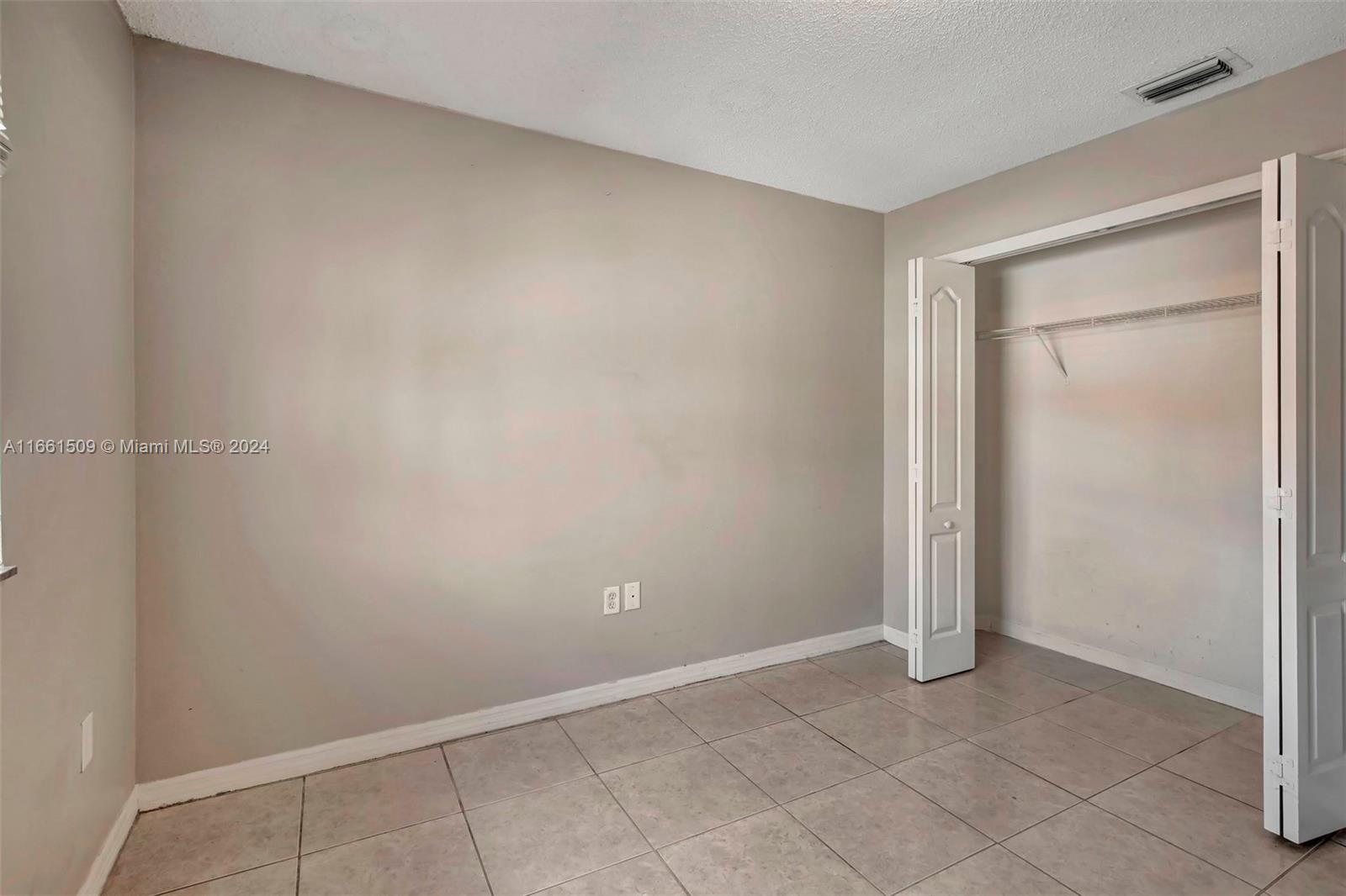2527 West 76th Street, Unit 208 Hialeah, FL 33016 - Photo 35 of 37 a view of an empty room