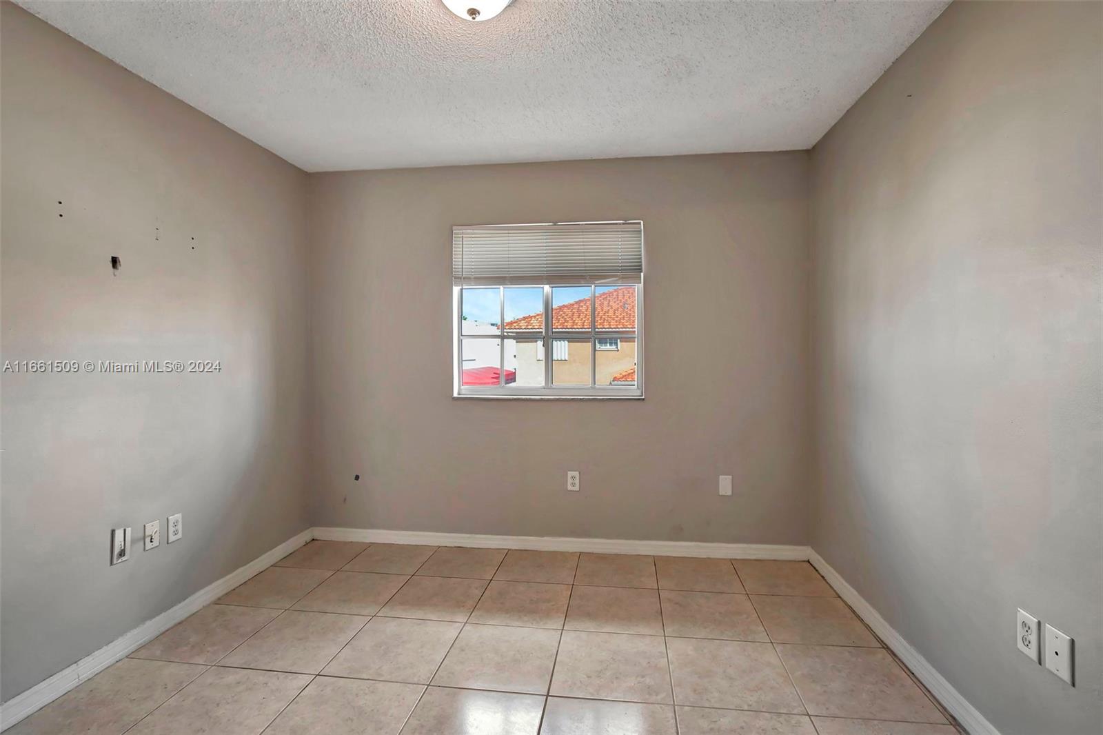 2527 West 76th Street, Unit 208 Hialeah, FL 33016 - Photo 37 of 37 a view of a window in an empty room