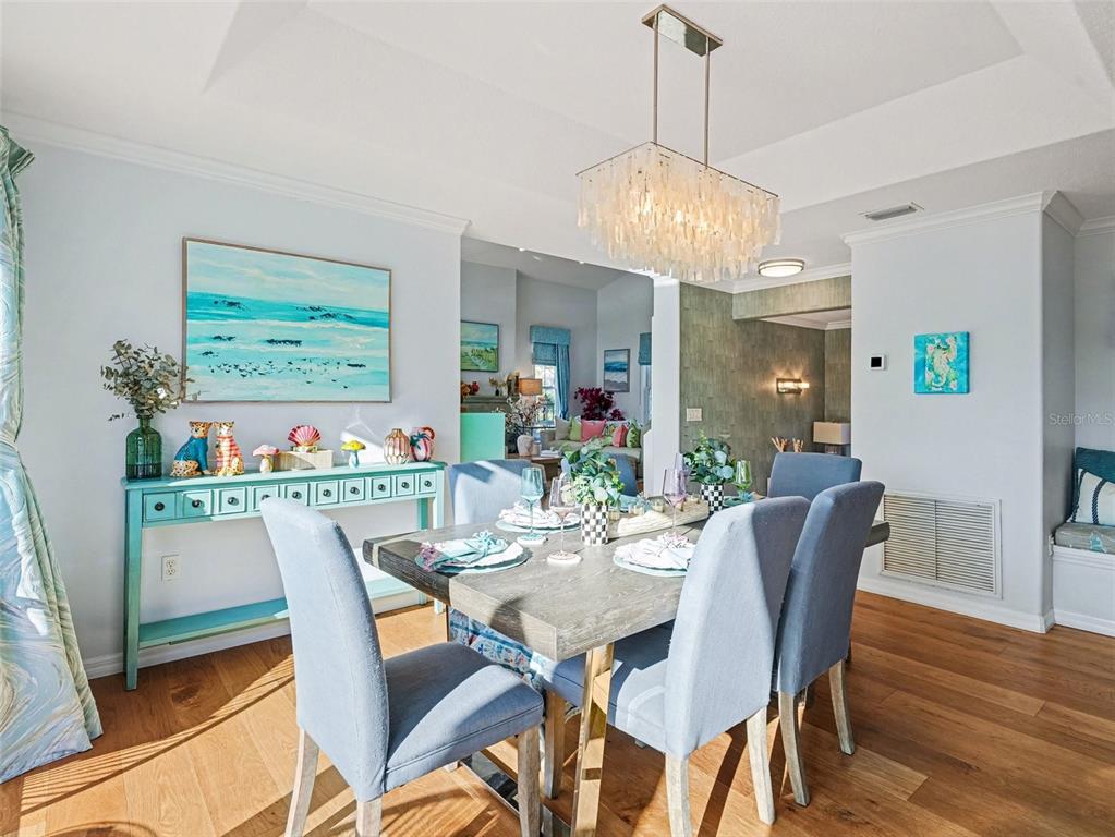 129 Hammock Road Anna Maria, FL 34216 - Photo 14 of 52 a view of a dining room with furniture window and wooden floor