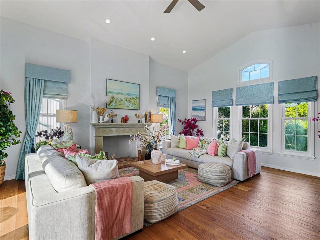 129 Hammock Road Anna Maria, FL 34216 - Photo 15 of 52 a living room with fireplace furniture and a large window