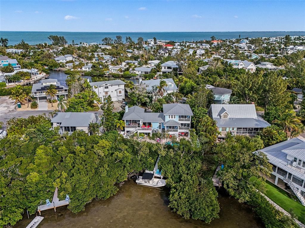 129 Hammock Road Anna Maria, FL 34216 - Photo 2 of 52 an aerial view of a city with lots of residential buildings