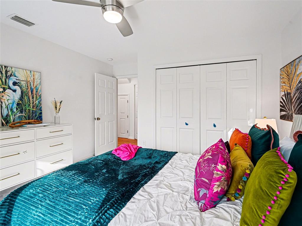 129 Hammock Road Anna Maria, FL 34216 - Photo 23 of 52 a bedroom with a bed and a closet