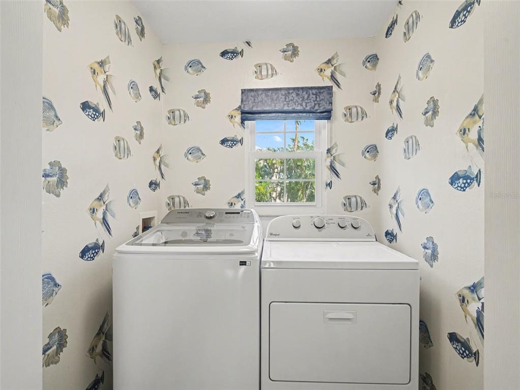 129 Hammock Road Anna Maria, FL 34216 - Photo 26 of 52 a utility room with dryer and washer