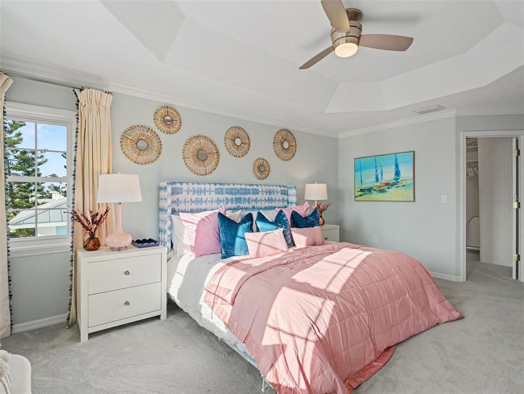 129 Hammock Road Anna Maria, FL 34216 - Photo 28 of 52 a bedroom with a bed and a window