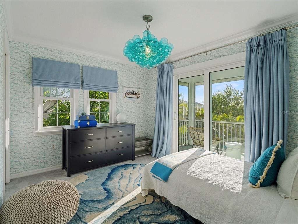 129 Hammock Road Anna Maria, FL 34216 - Photo 29 of 52 a bed room with a bed and a window
