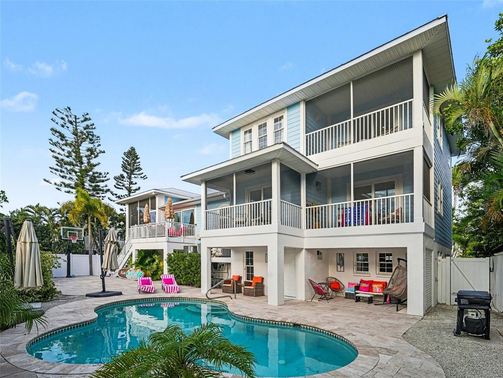 129 Hammock Road Anna Maria, FL 34216 - Photo 3 of 52 a front view of building with street