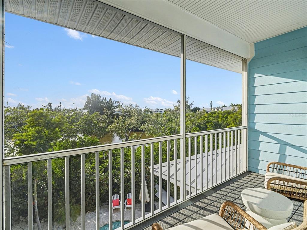 129 Hammock Road Anna Maria, FL 34216 - Photo 34 of 52 a view of a balcony with wooden floor