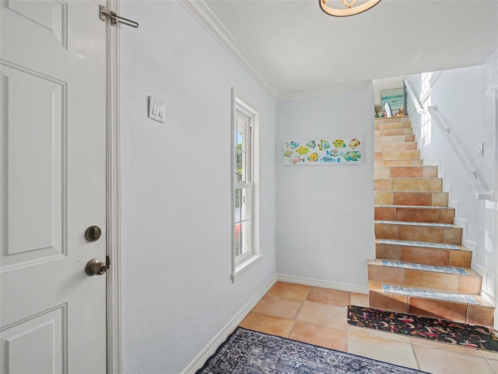 129 Hammock Road Anna Maria, FL 34216 - Photo 35 of 52 a view of an entryway with staircase
