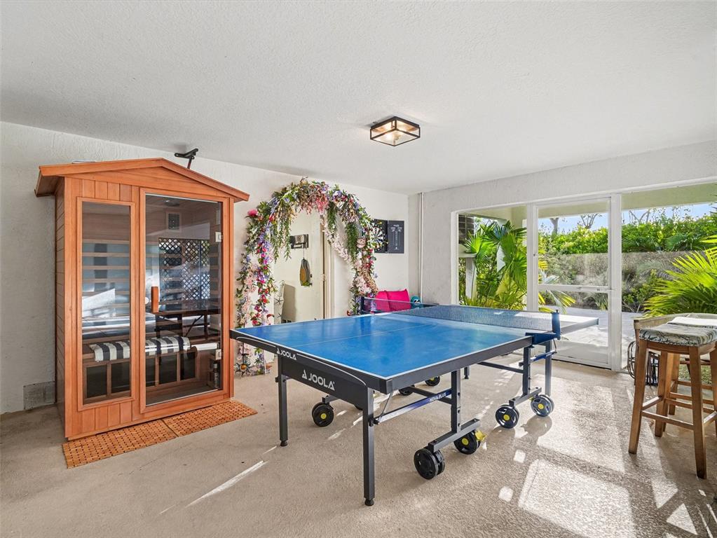 129 Hammock Road Anna Maria, FL 34216 - Photo 36 of 52 a dining room with a table and chairs