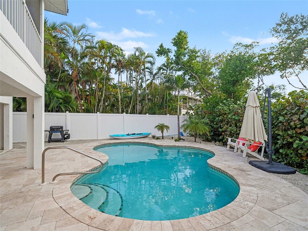129 Hammock Road Anna Maria, FL 34216 - Photo 39 of 52 a view of a swimming pool with sitting area