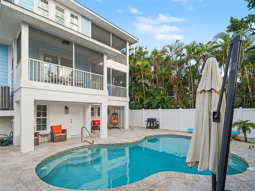 129 Hammock Road Anna Maria, FL 34216 - Photo 40 of 52 a view of outdoor space yard deck patio and fire pit