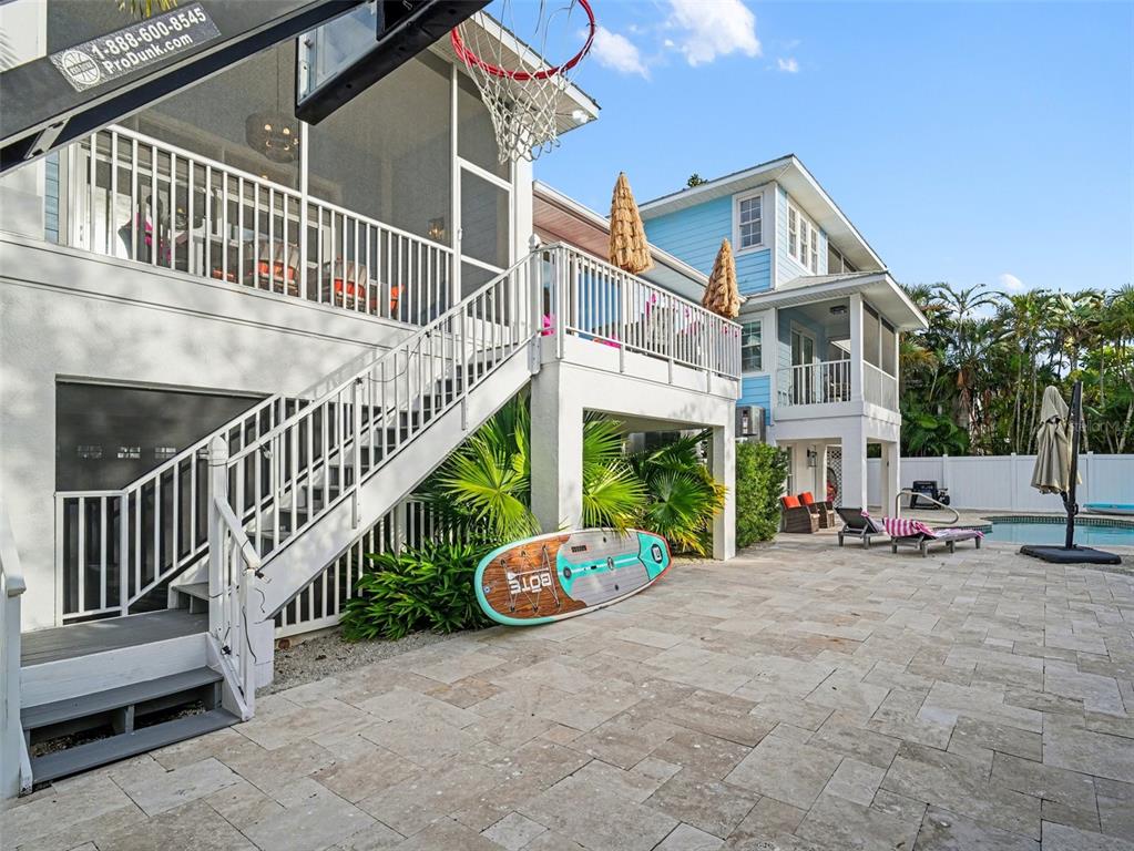 129 Hammock Road Anna Maria, FL 34216 - Photo 41 of 52 a view of a house with a yard and deck