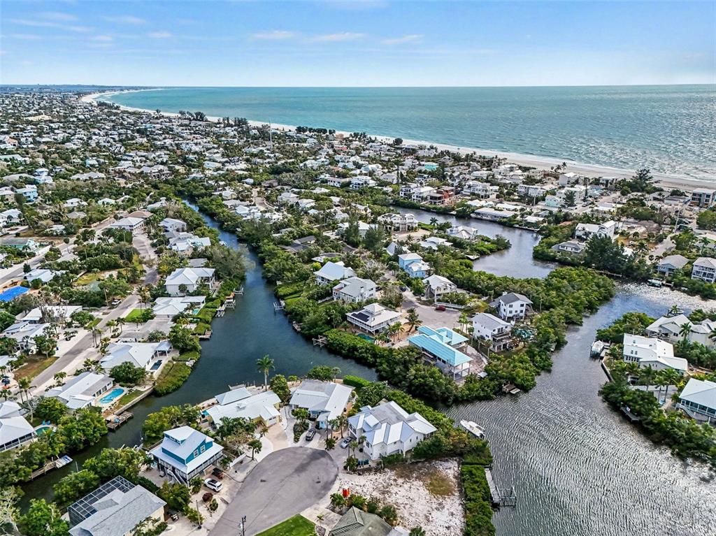 129 Hammock Road Anna Maria, FL 34216 - Photo 45 of 52 an aerial view of a city with ocean view in back