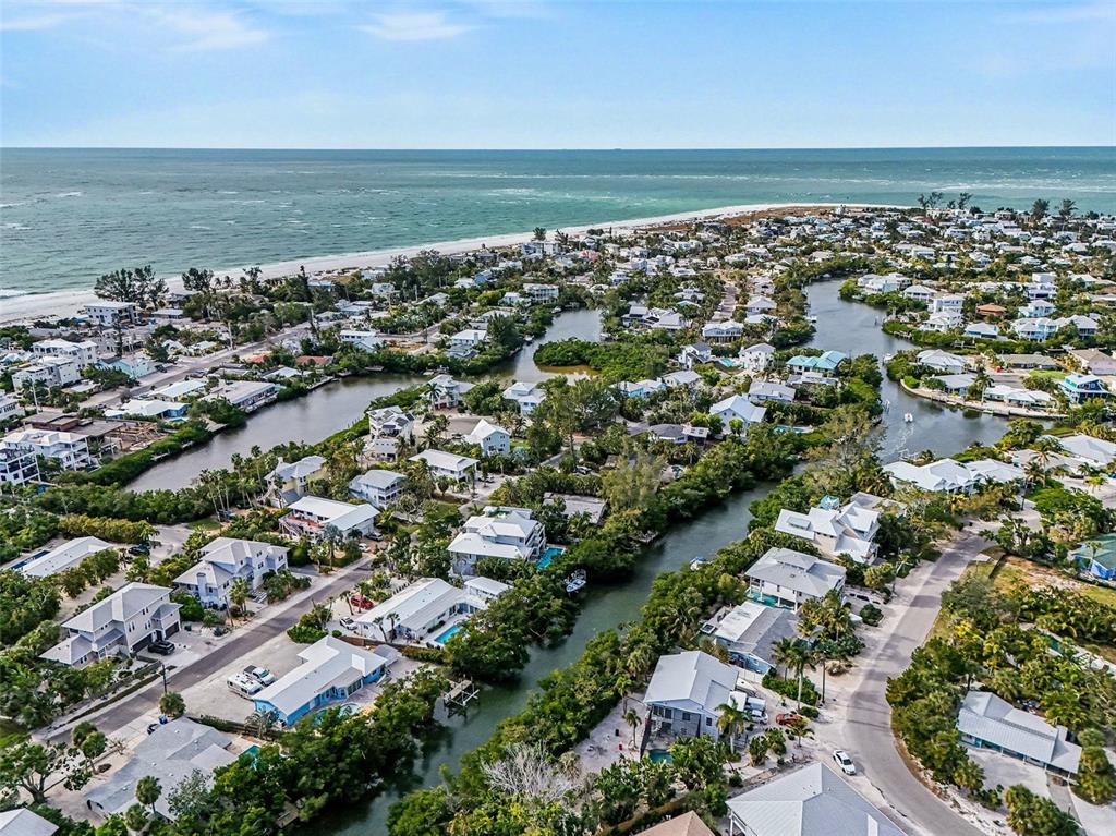 129 Hammock Road Anna Maria, FL 34216 - Photo 51 of 52 an aerial view of a city with ocean view