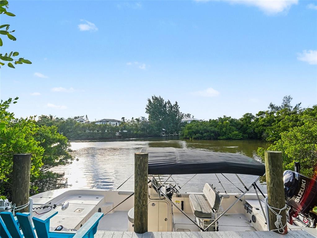 129 Hammock Road Anna Maria, FL 34216 - Photo 6 of 52 a view of a lake with roof deck and city view