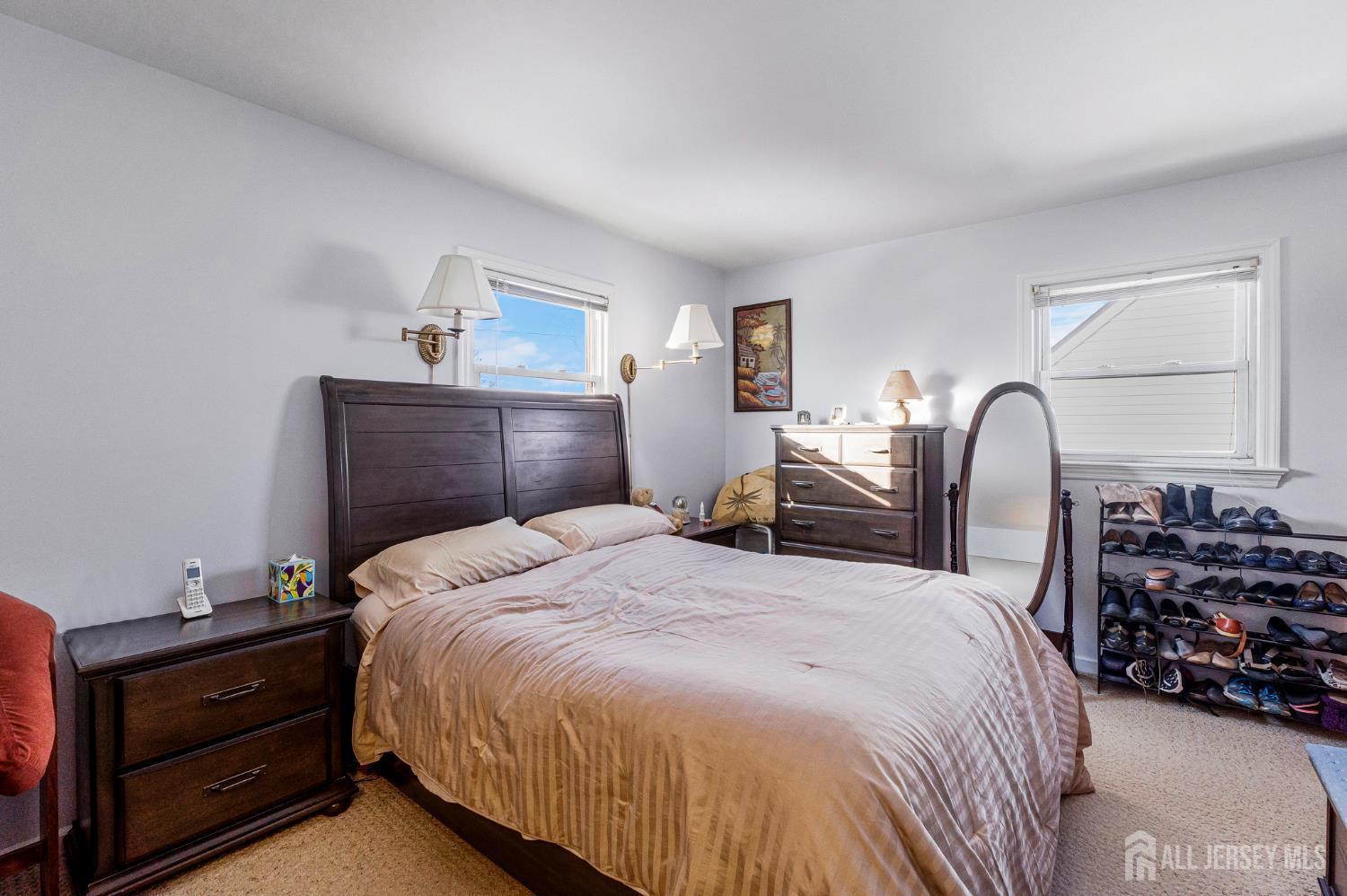 241 Cook Avenue Middlesex, NJ 08846 - Photo 15 of 33 a bedroom with a bed and a dresser with mirror