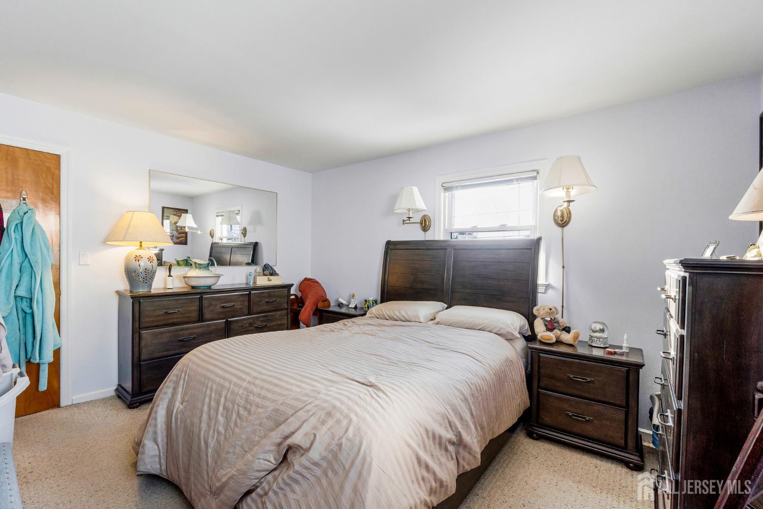 241 Cook Avenue Middlesex, NJ 08846 - Photo 16 of 33 a bedroom with a bed and a mirror