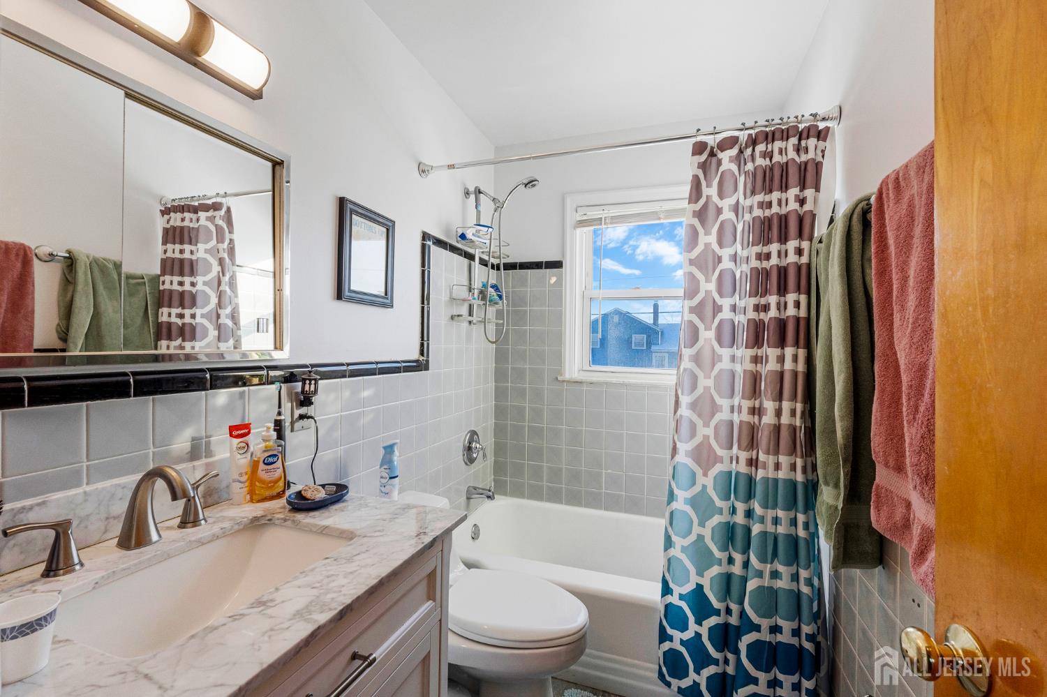 241 Cook Avenue Middlesex, NJ 08846 - Photo 21 of 33 a bathroom with a granite countertop sink toilet and shower