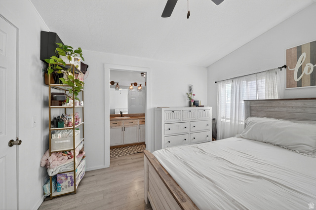 160 Cushing Way Layton, UT 84041 - Photo 18 of 23 Bedroom featuring light wood-finish flooring and a white paneled door