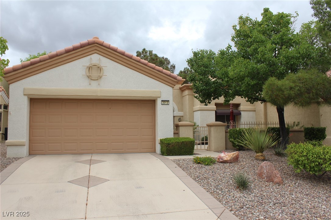 Mediterranean / spanish house with fence, stucco s