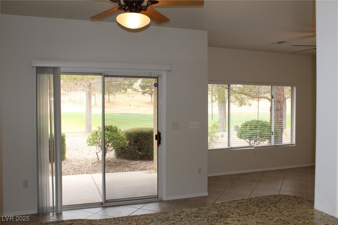 2013 Capestone Street Las Vegas, NV 89134 - Photo 11 of 40 Doorway to outside with baseboards, a ceiling fan,