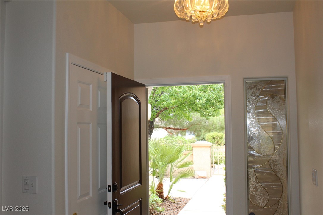2013 Capestone Street Las Vegas, NV 89134 - Photo 17 of 40 Entrance foyer with an inviting chandelier