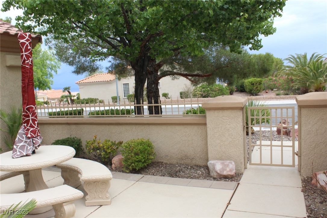 2013 Capestone Street Las Vegas, NV 89134 - Photo 20 of 40 View of patio featuring a fenced front yard and a